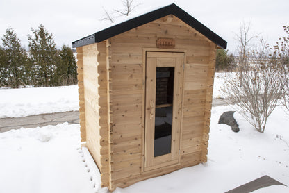 Three-quarter view of the Granby Cabin Sauna showing the door and side wall