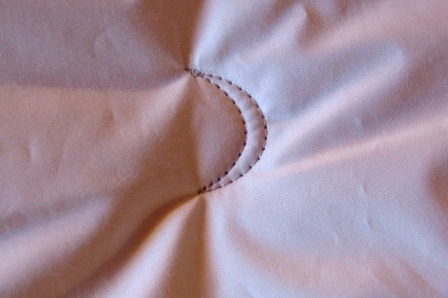 Crescent Moon Alpaca & Wool Comforter on a bed