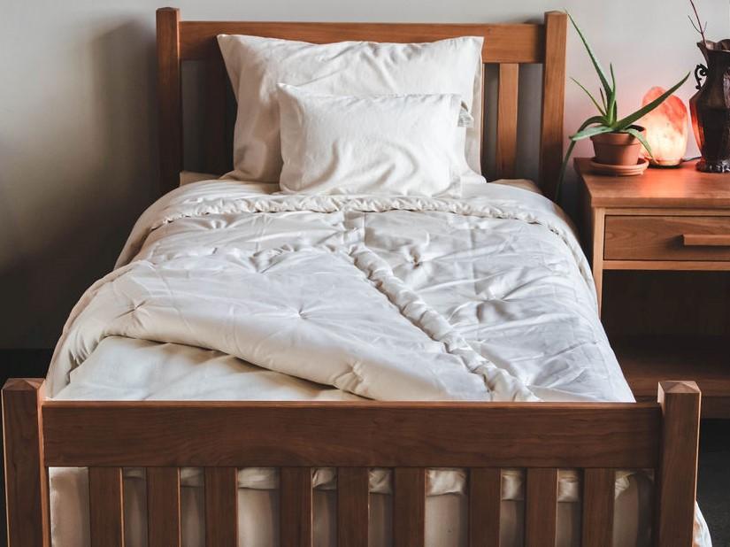 Holy Lamb Organics All-Natural Wool Comforter on a bed