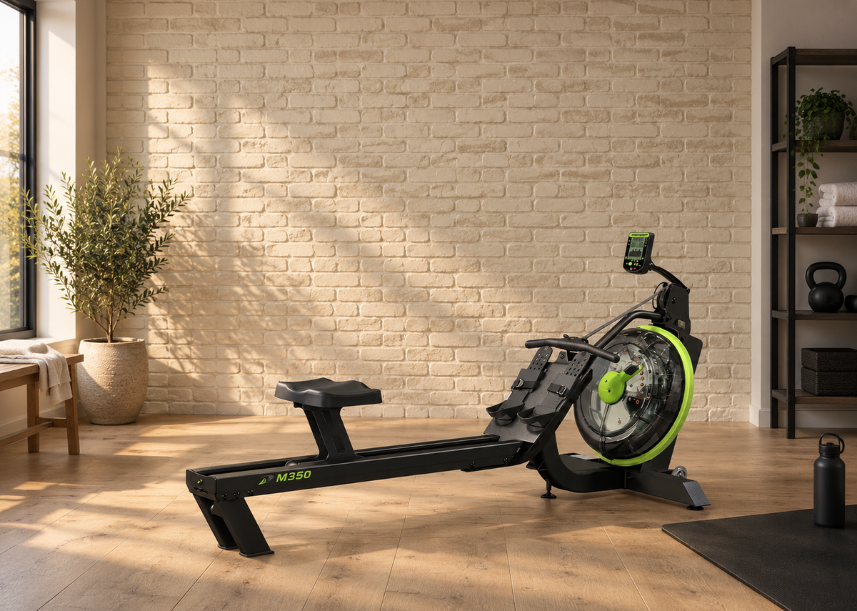 Dynamic Fluid M350 water rower in a brick-wall home training studio