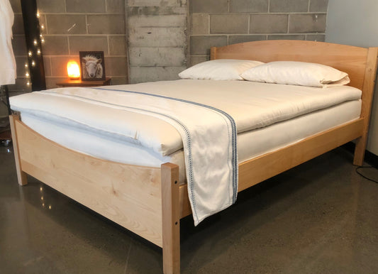 Holy Lamb Organics Wool & Latex Mattress Topper on a bed